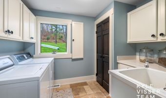 589 Grand River Dr NE, Ada, MI 49301