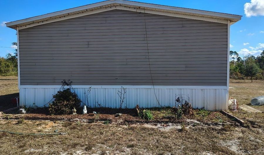 22884 NW Lake Mckinzie Blvd, Altha, FL 32421 - 4 Beds, 3 Bath